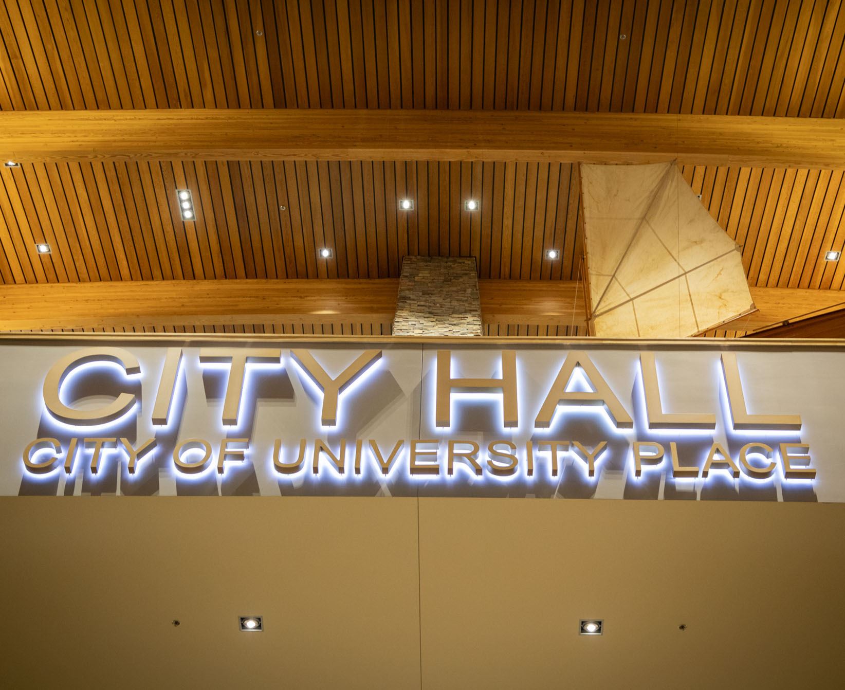 Photo of city hall sign indoors