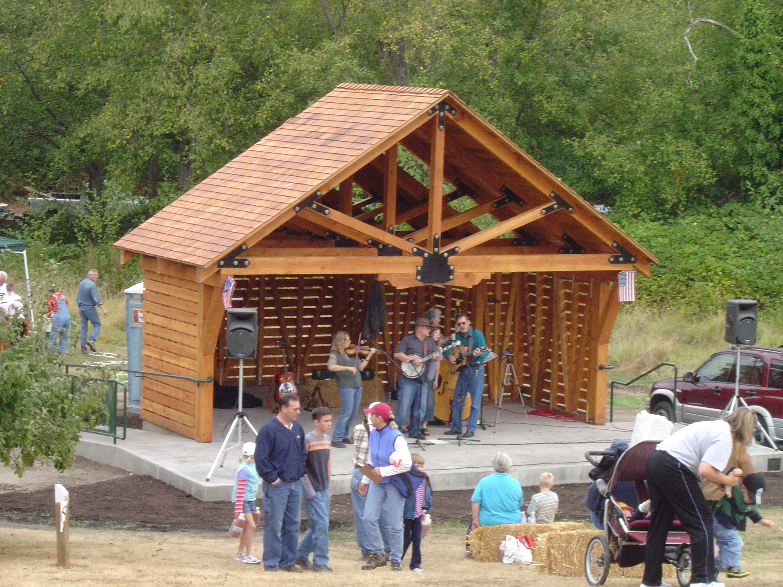 People listening to a band play on a stage